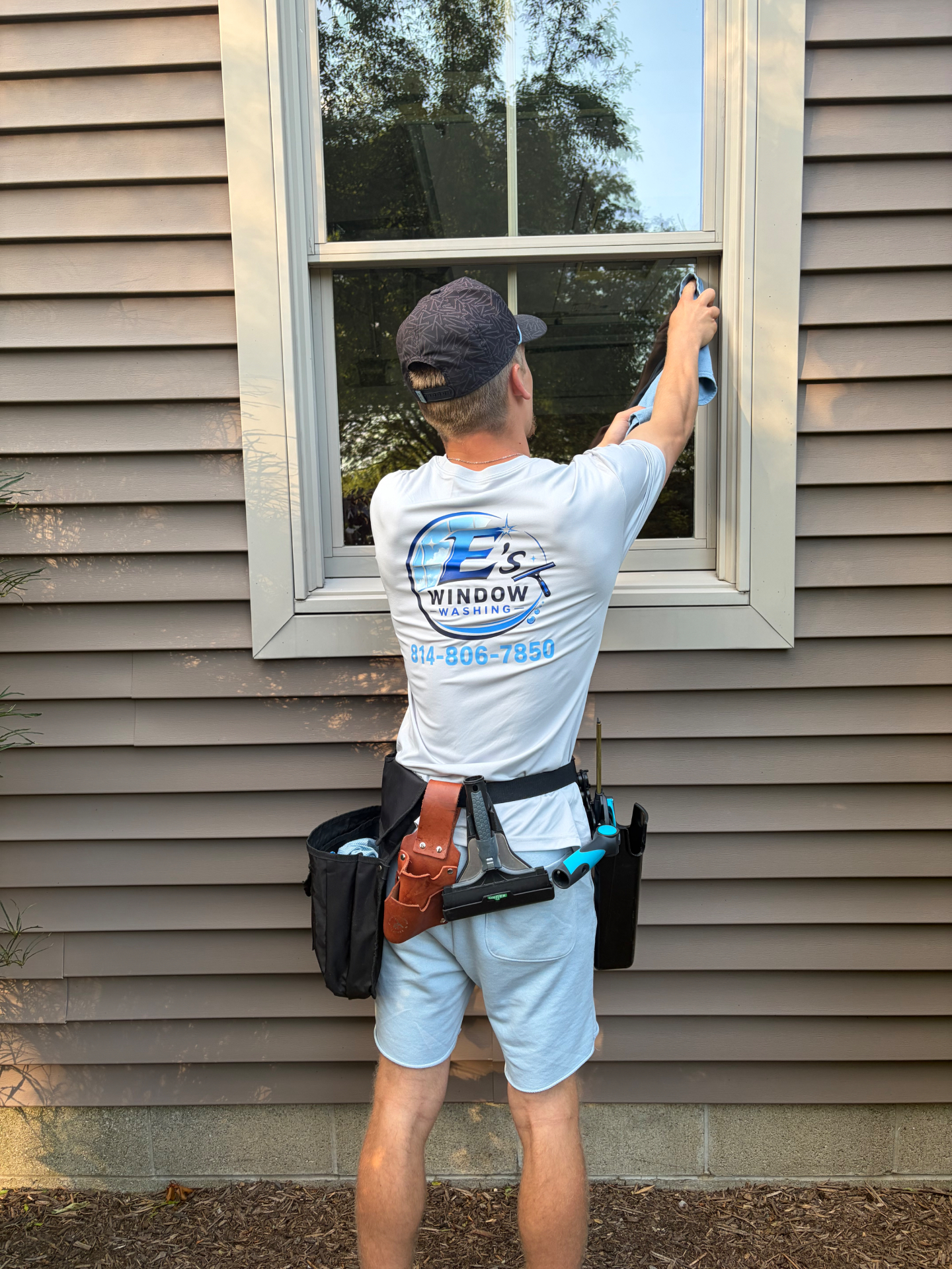 Ethan cleaning a window